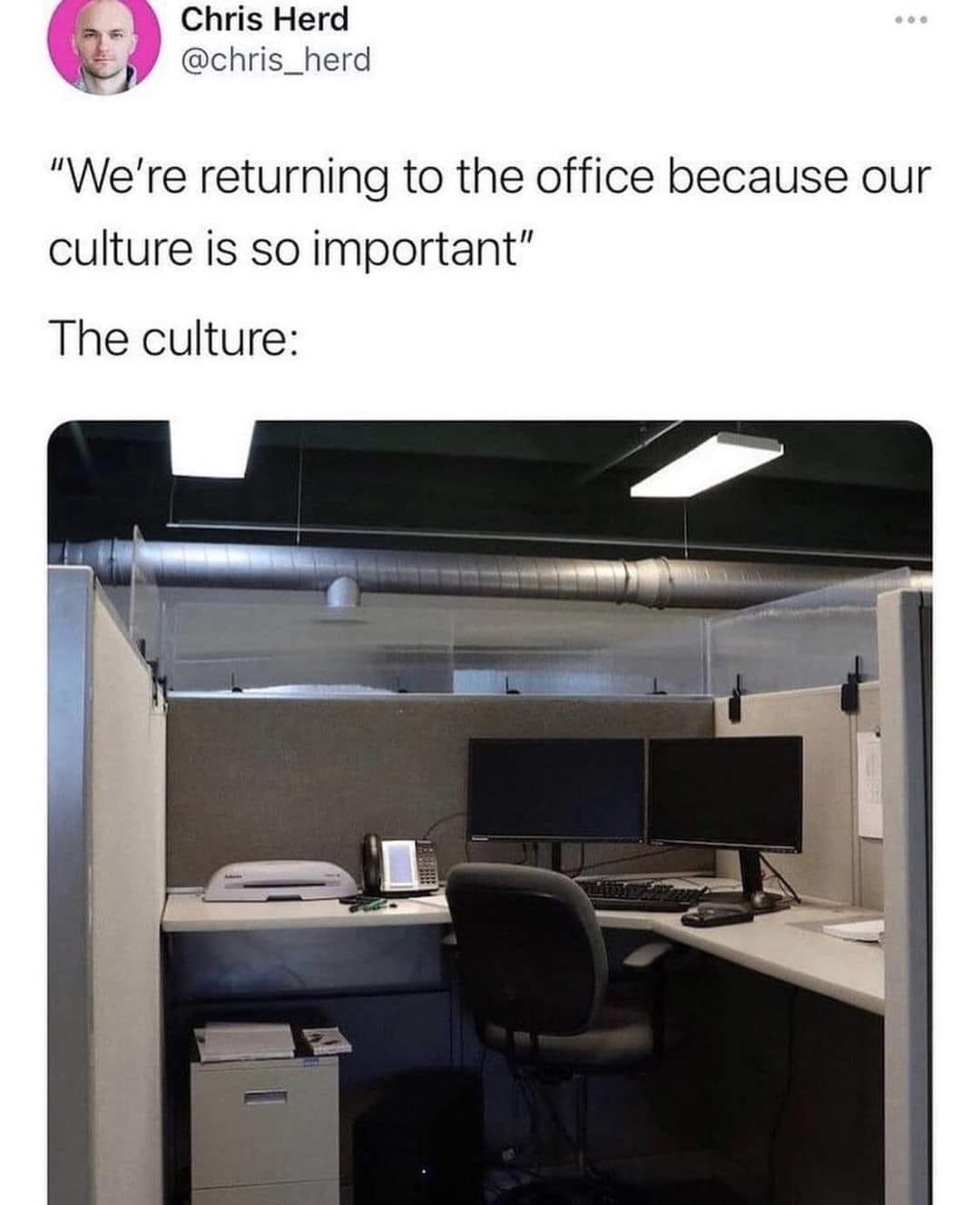 This meme is a humorous commentary on the shift in work culture. The image shows a typical office workspace with a single chair, but it's empty. The text above the image reads: "We're returning to the office because our culture is so important." The irony is that the office is empty, implying that the company's culture is not as important as they claim.